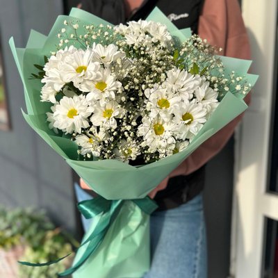 Bouquet of chamomile chrysanthemums with gypsophila